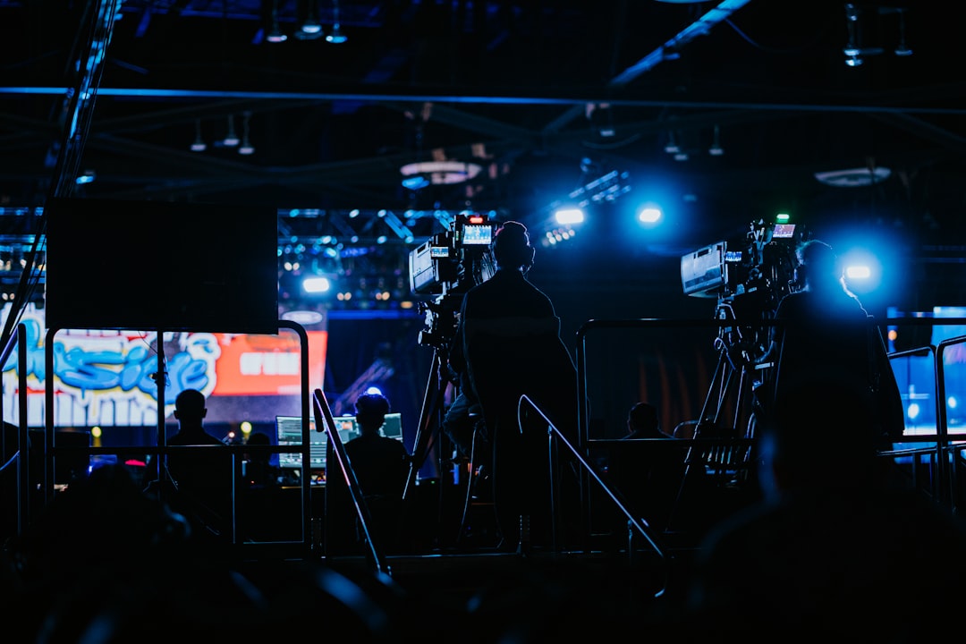 about-01 a-group-of-people-standing-in-front-of-a-camera-ait5t1vbsbw